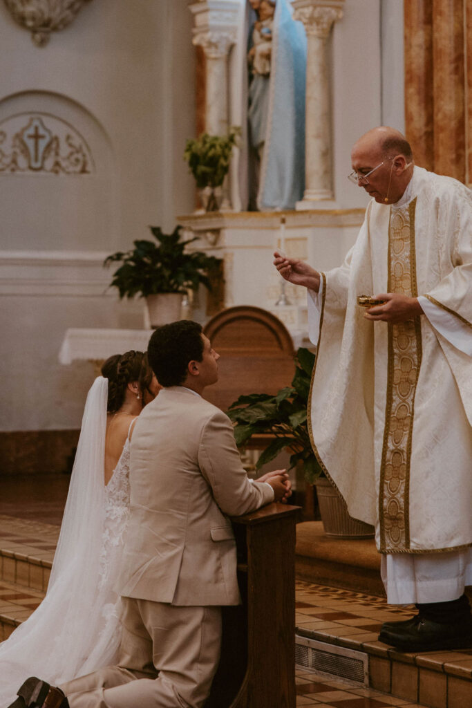 couple praying during the eucharist 