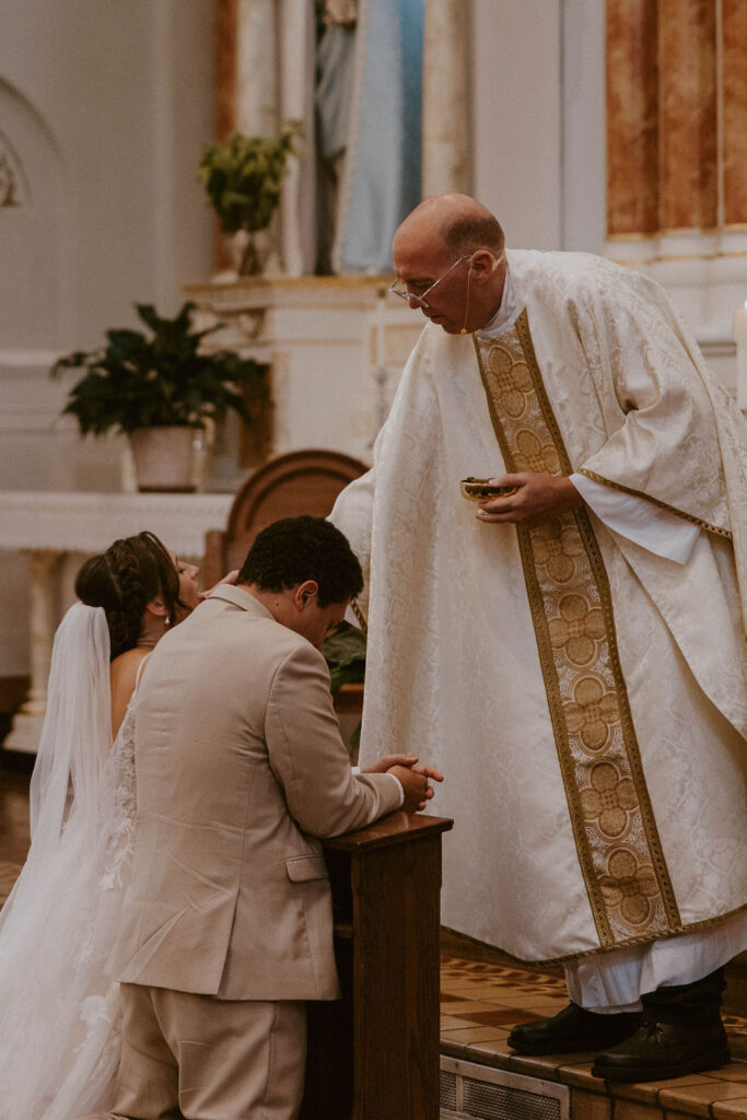 couple praying during the eucharist 