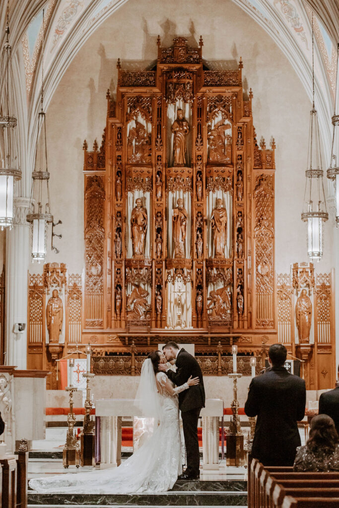 bride and groom during their wedding ceremony in a church in cleveland