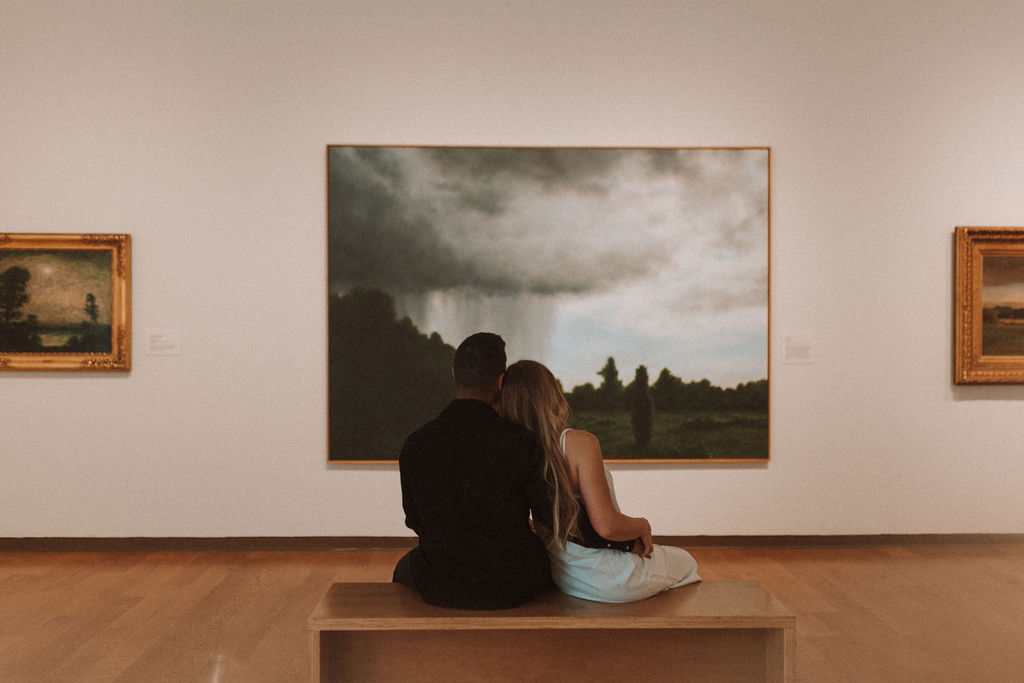 couple posing in an art museum for a couples photoshoot in Orlando - art museum photoshoot