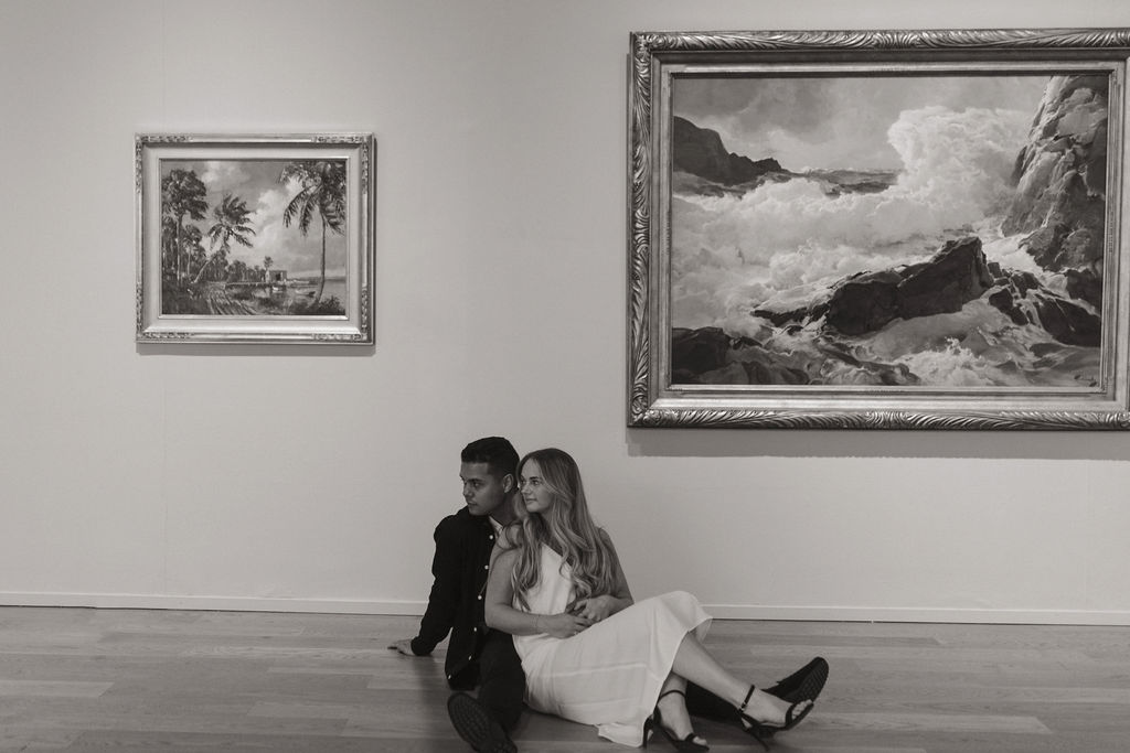 couple posing in an art museum for a couples photoshoot in Orlando - art museum photoshoot
