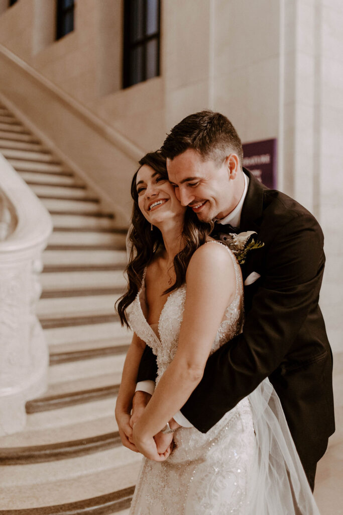 couple posing in a church after their wedding ceremony - wedding in cleveland