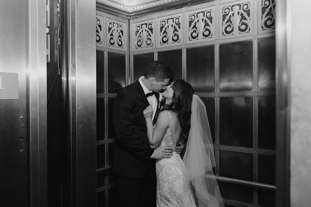 couple posing in a church after their wedding ceremony - wedding in cleveland