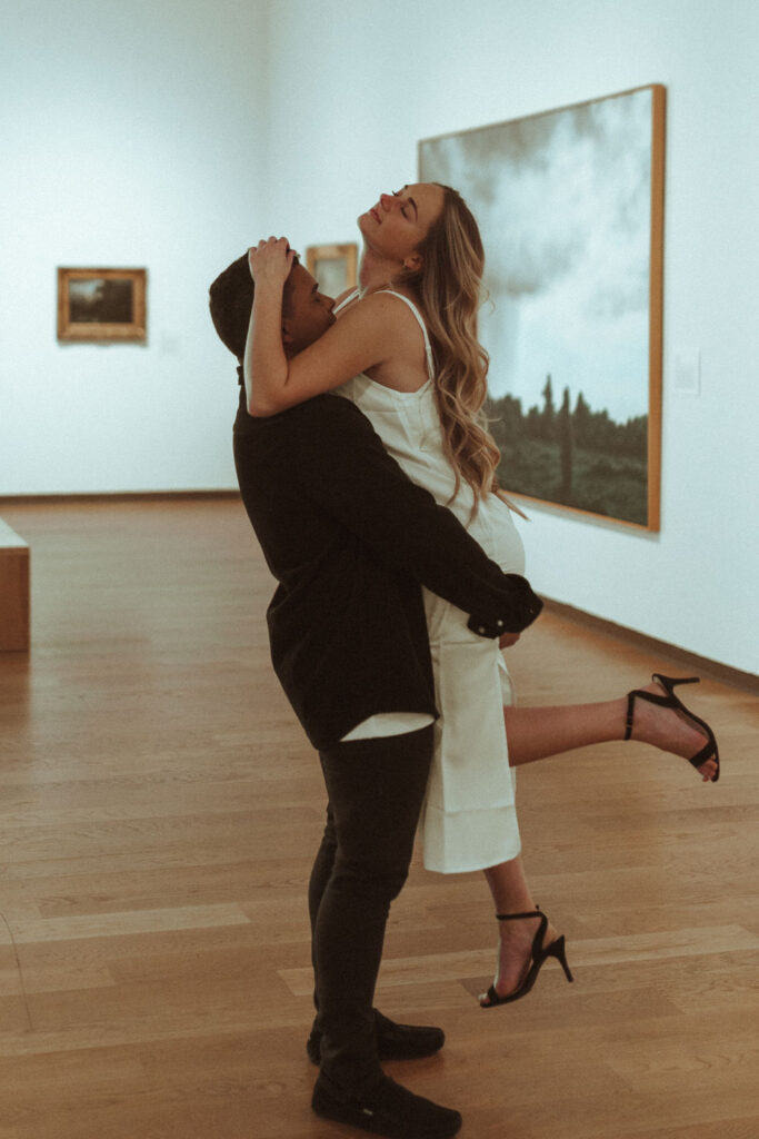 couple posing in an art museum for a couples photoshoot in Orlando - art museum photoshoot
