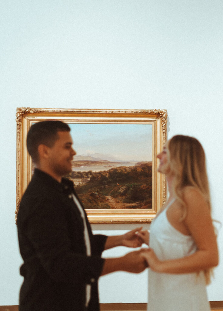 couple posing in an art museum for a couples photoshoot in Orlando - art museum photoshoot | Vintage Style Art Museum Photoshoot in Orlando
