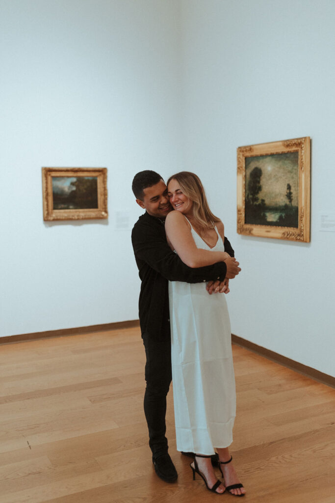 couple posing in an art museum for a couples photoshoot in Orlando - art museum photoshoot