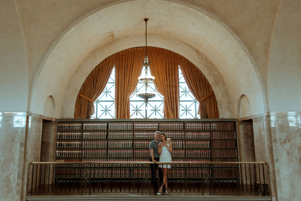 couple posing for a photoshoot in a library - Lincoln Nebraska Capitol Building
