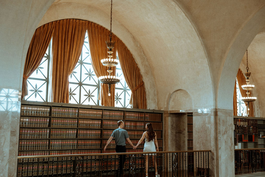 couple posing for a photoshoot in a library - Lincoln Nebraska Capitol Building
