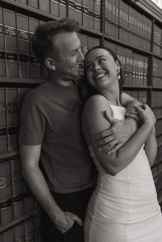 newly engaged couple posing in nebraska capitol building - ruthie isaacson photography