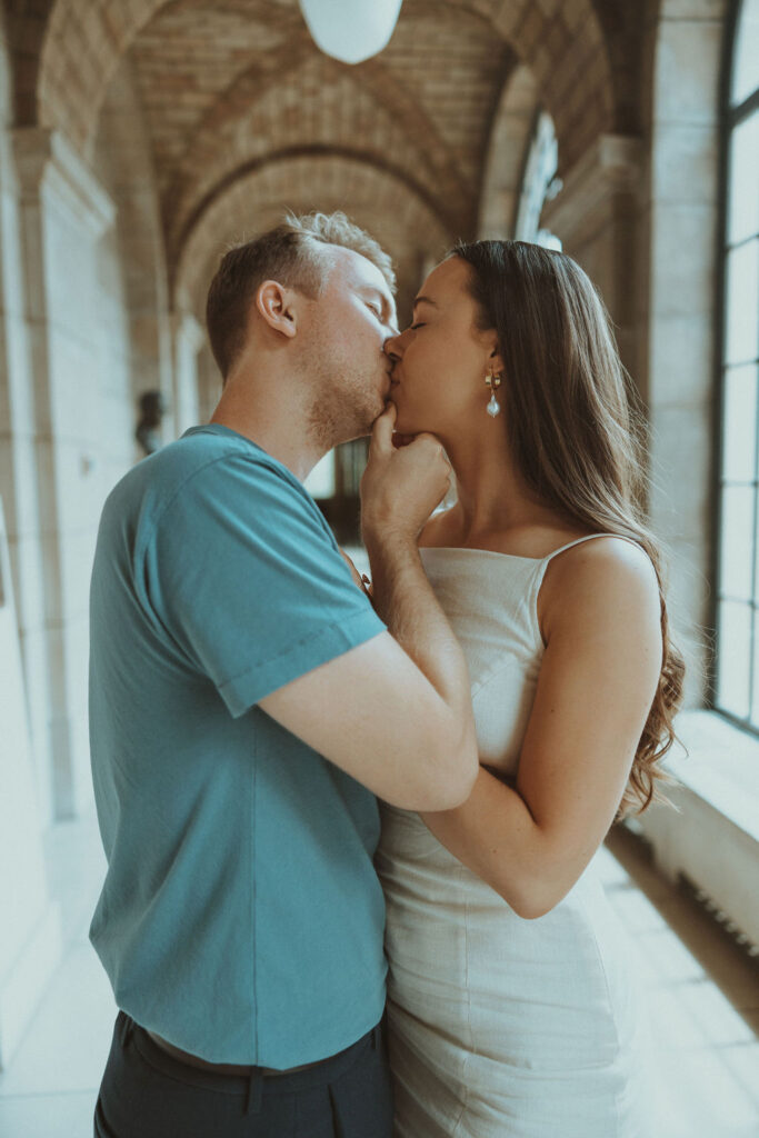 newly engaged couple posing in nebraska capitol building - ruthie isaacson photography