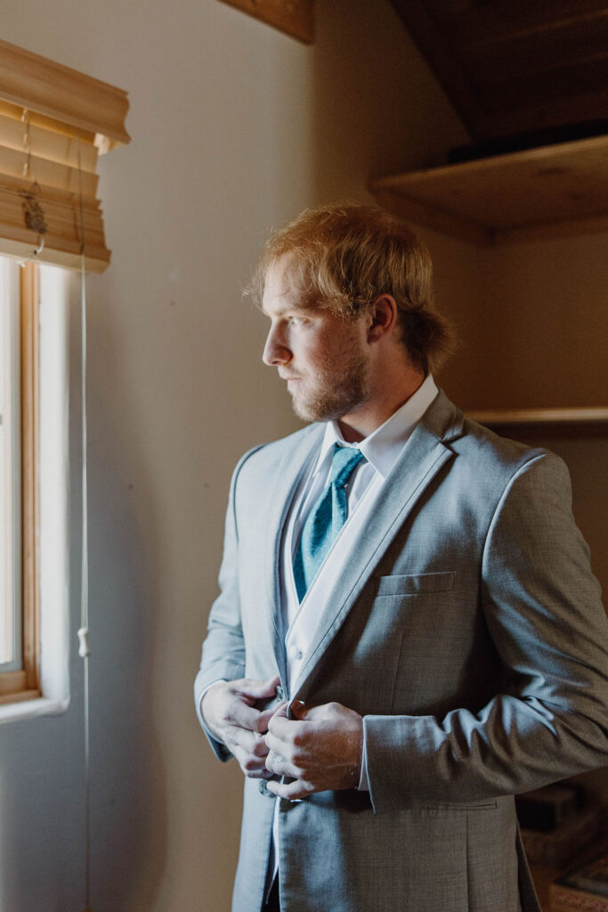 groom getting ready during Majestic Grand Tetons Elopement Day