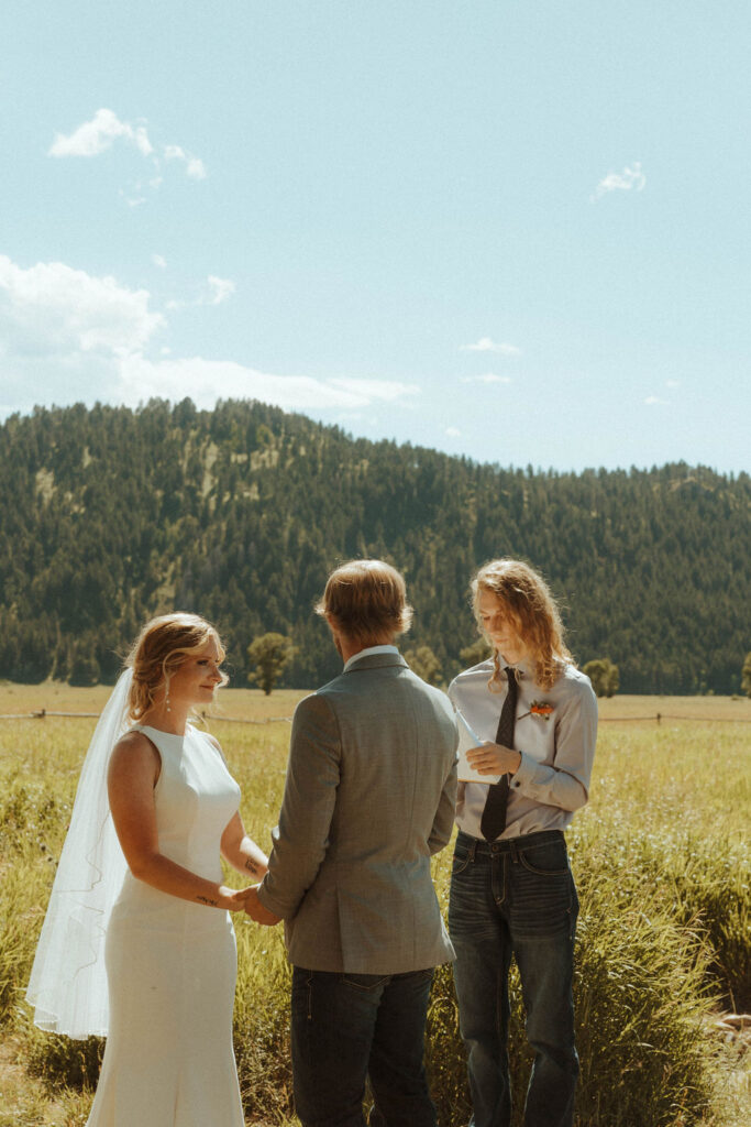 newlyweds posing in grand teton after their wedding for their wedding portraits | Majestic Grand Tetons Elopement Day
