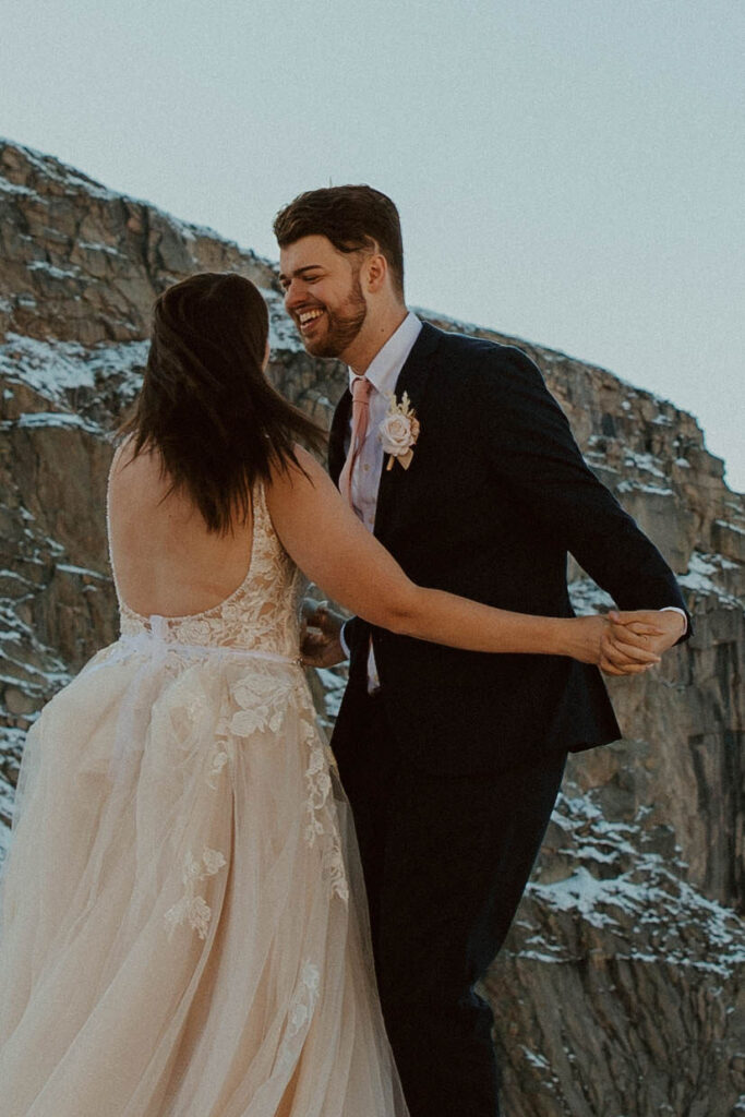couple posing in the colorado mountains for their post wedding photoshoot
