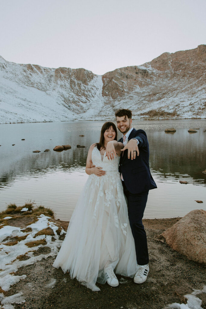 couple posing in the colorado mountains for their post wedding photoshoot