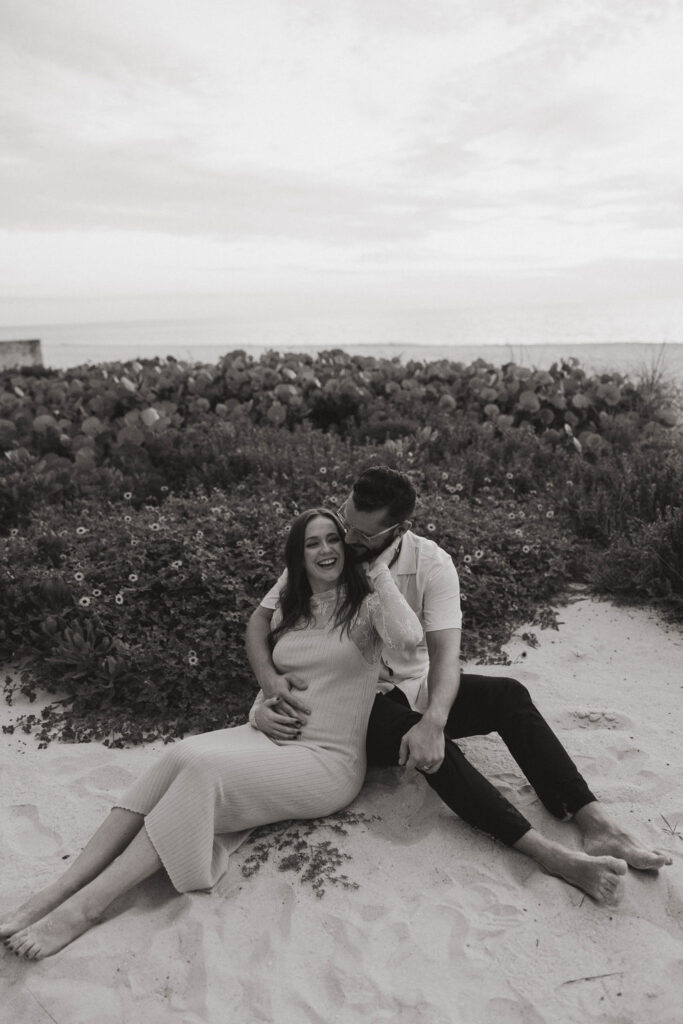 black and white photo of the beautiful couple during their baby announcement photoshoot