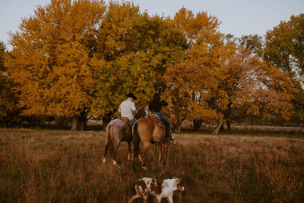 engaged couple riding their horses